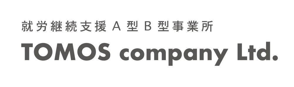 TOMOS company企業ロゴ